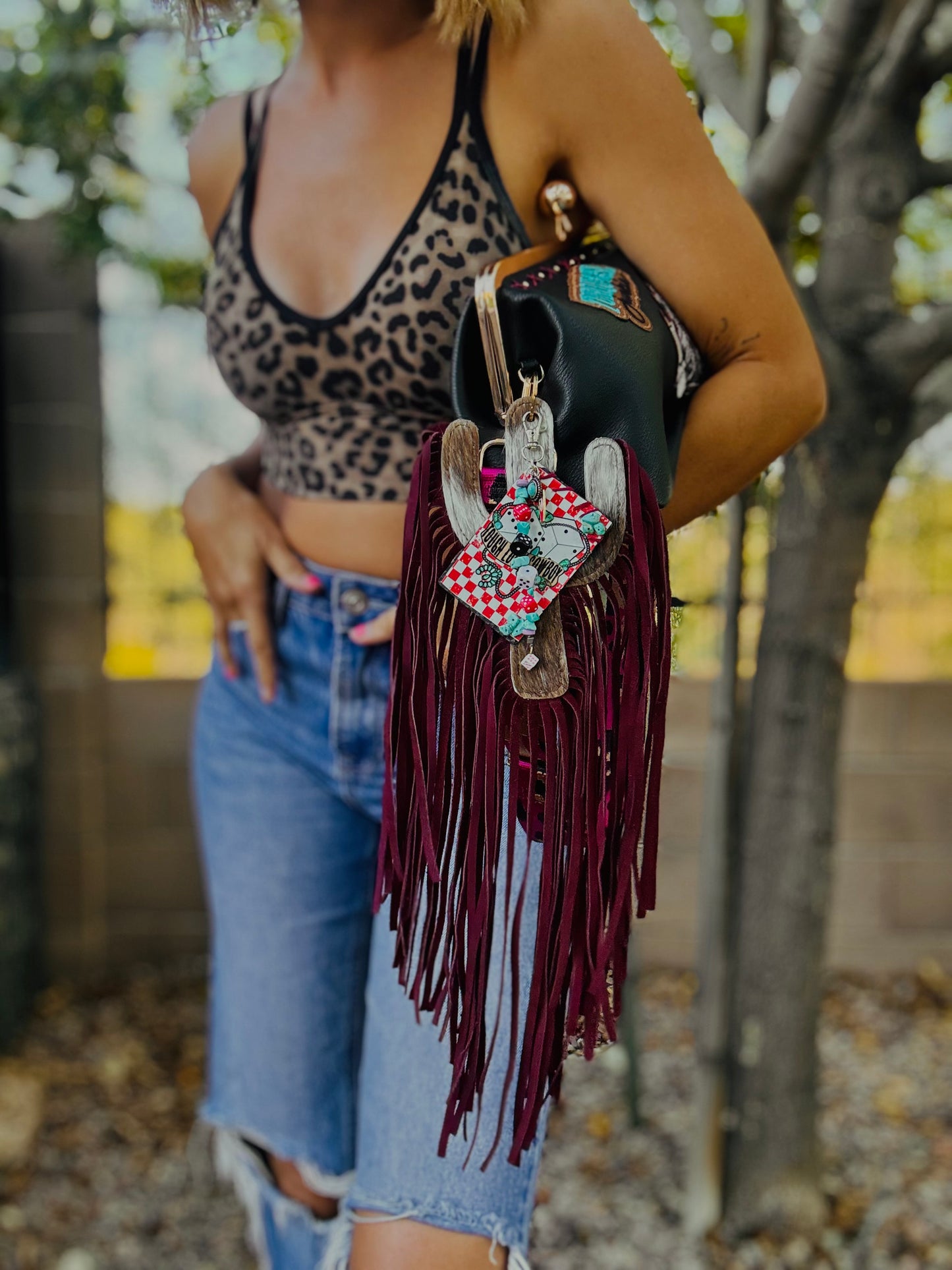 23- THE RUMORS ARE TRUE - THE KYLIE KISS KLUTCH - traditional leather kiss clutch with two removable straps included.