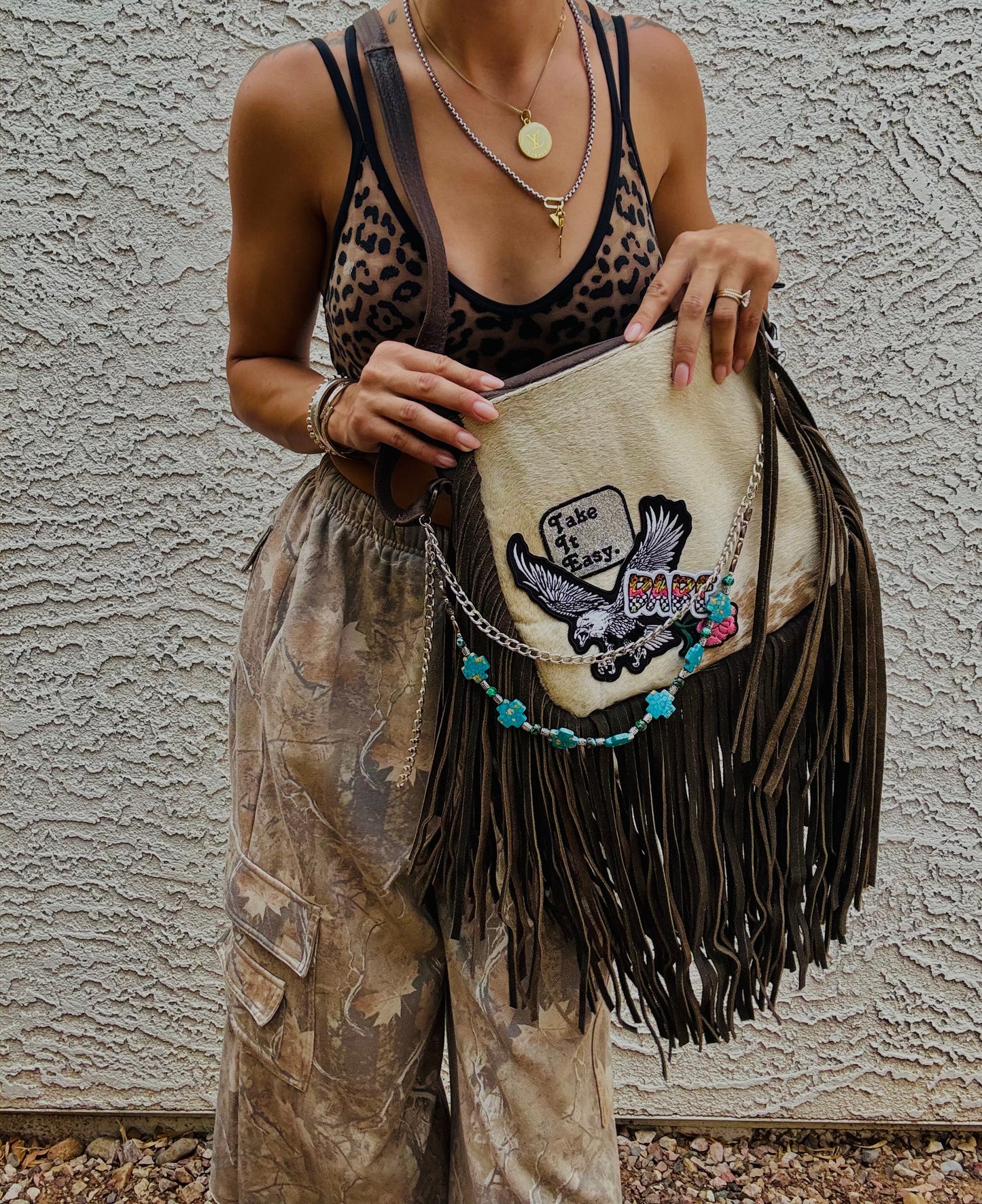 AUGBAG- GENUINE COWHIDE HAIR ON CROSSBODY FRINGE BAG- REAL AUTHENTIC WITH EAGLE TAKE IT EASY VIBES AND HANDBEADED CHAIN WORK.