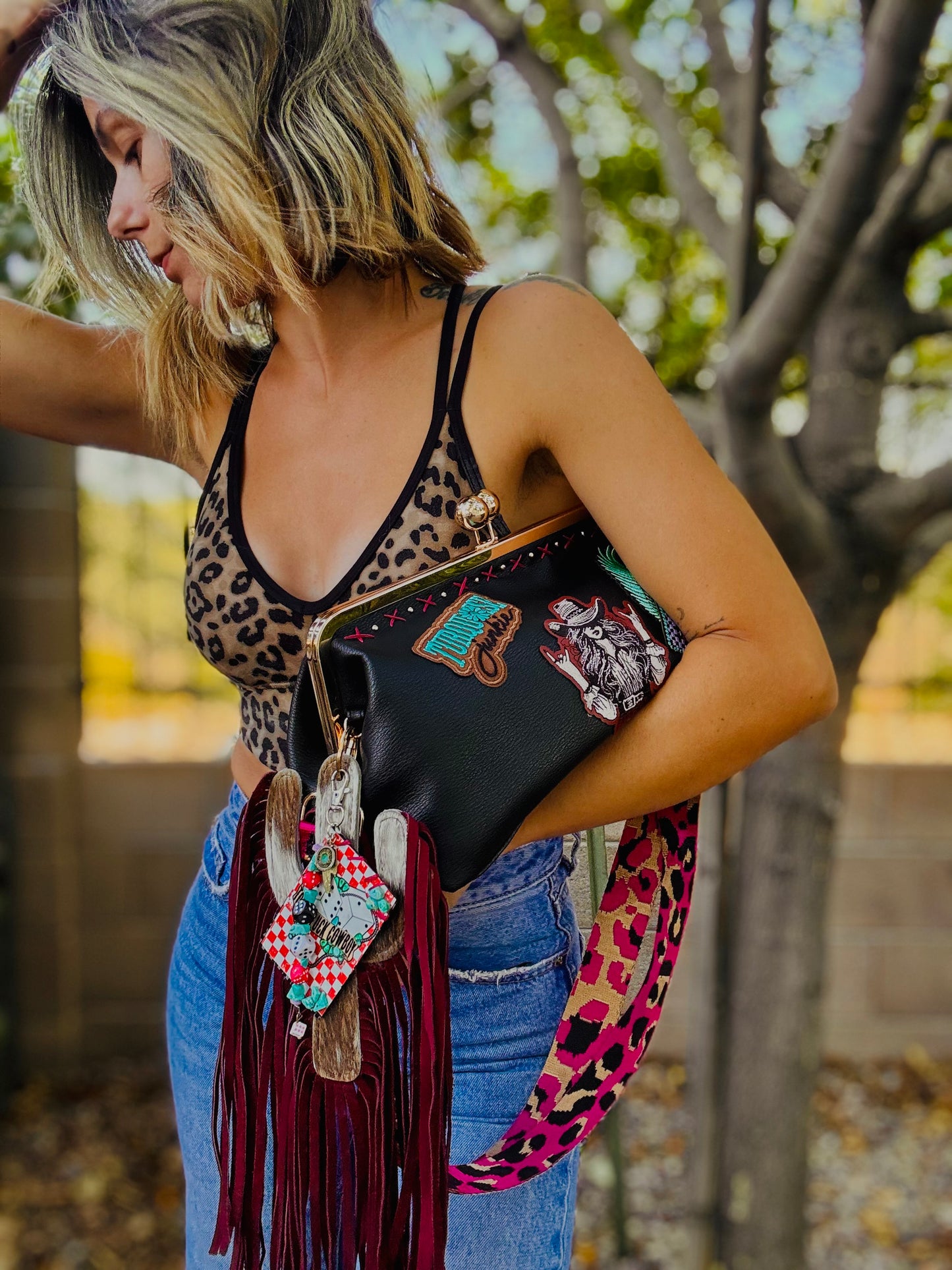 23- THE RUMORS ARE TRUE - THE KYLIE KISS KLUTCH - traditional leather kiss clutch with two removable straps included.