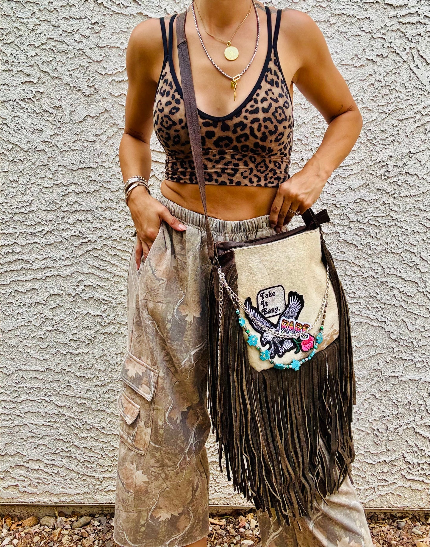 AUGBAG- GENUINE COWHIDE HAIR ON CROSSBODY FRINGE BAG- REAL AUTHENTIC WITH EAGLE TAKE IT EASY VIBES AND HANDBEADED CHAIN WORK.