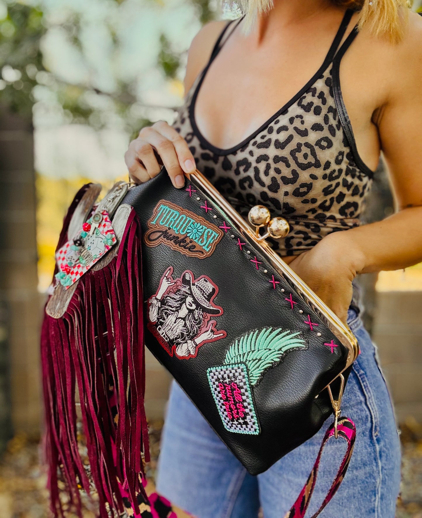 23- THE RUMORS ARE TRUE - THE KYLIE KISS KLUTCH - traditional leather kiss clutch with two removable straps included.