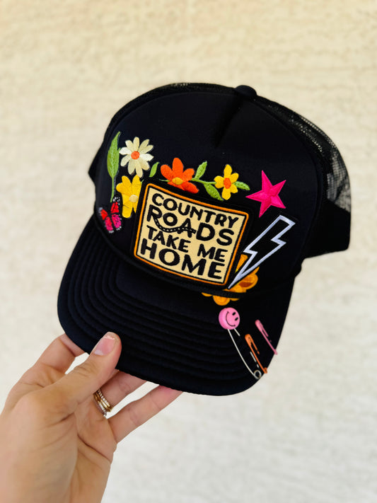 CM CO. Neon Black Country Roads Trucker