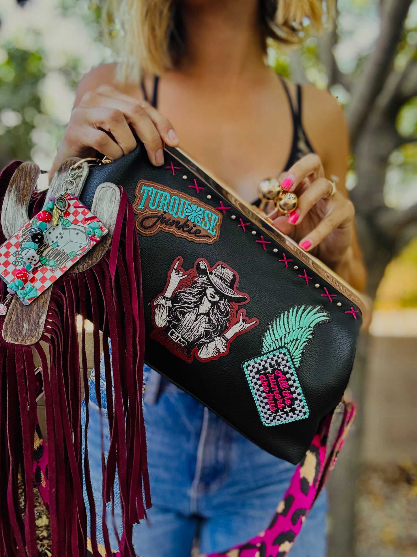 23- THE RUMORS ARE TRUE - THE KYLIE KISS KLUTCH - traditional leather kiss clutch with two removable straps included.