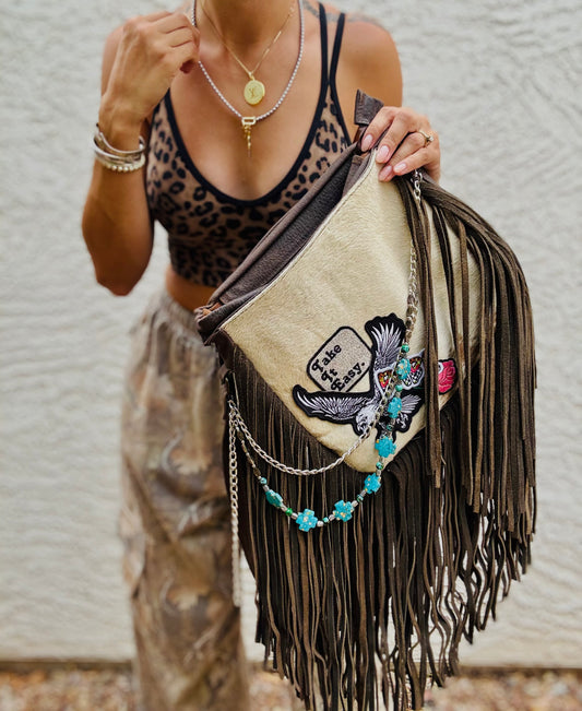 AUGBAG- GENUINE COWHIDE HAIR ON CROSSBODY FRINGE BAG- REAL AUTHENTIC WITH EAGLE TAKE IT EASY VIBES AND HANDBEADED CHAIN WORK.