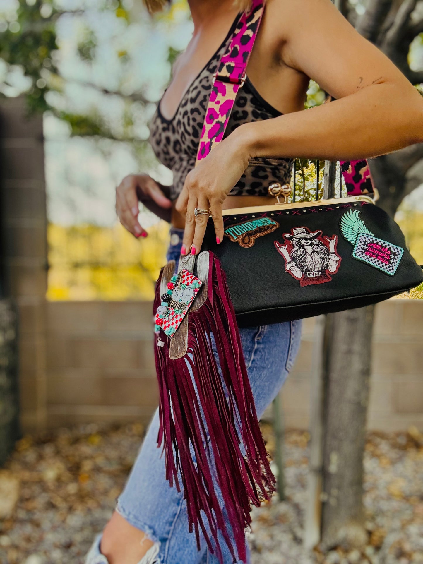 23- THE RUMORS ARE TRUE - THE KYLIE KISS KLUTCH - traditional leather kiss clutch with two removable straps included.