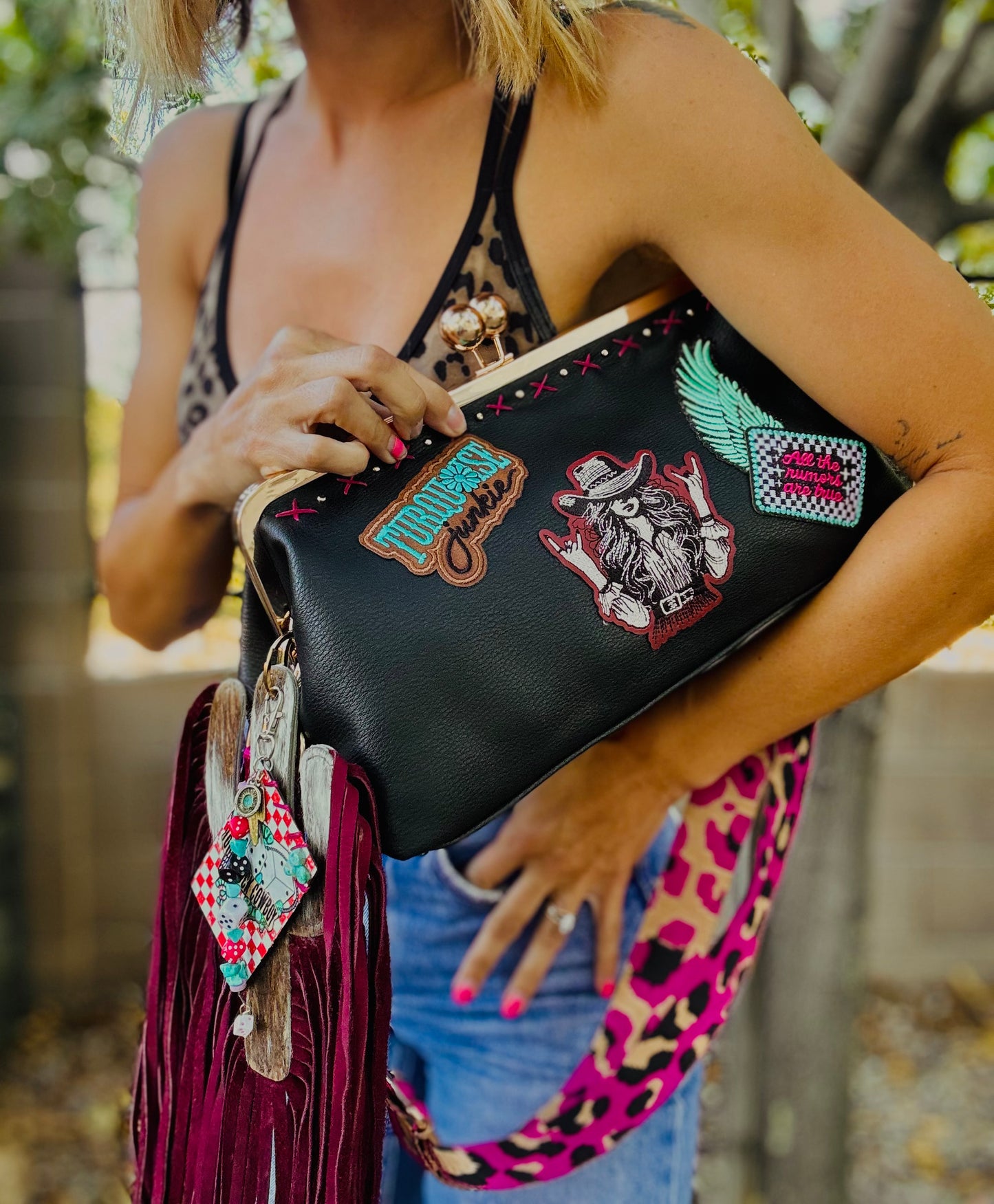 23- THE RUMORS ARE TRUE - THE KYLIE KISS KLUTCH - traditional leather kiss clutch with two removable straps included.